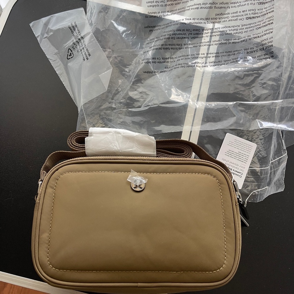 Lululemon Camera crossbody bag hardware is a dark gunmetal color